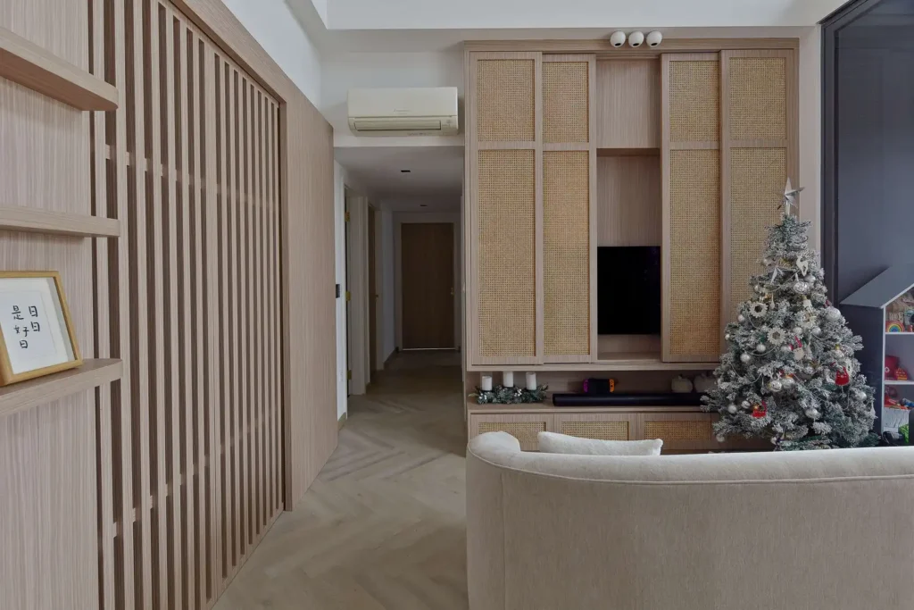 Japandi living room with rattan cabinets, herringbone floor and Christmas decor