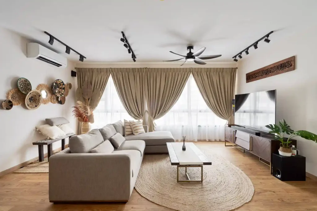 Modern farmhouse-inspired condo living room with rattan art and neutral palette reflecting fusion condo interior design.