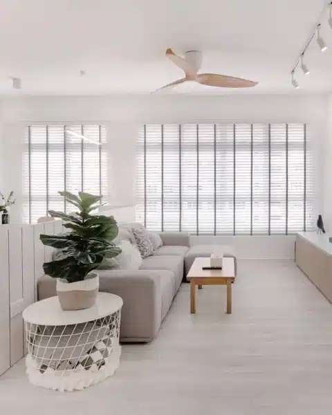 Minimalist house living room with white walls, long TV console and soft daylight