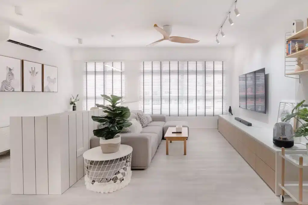 minimalist living room in KL condo with open floor plan and soft neutral palette