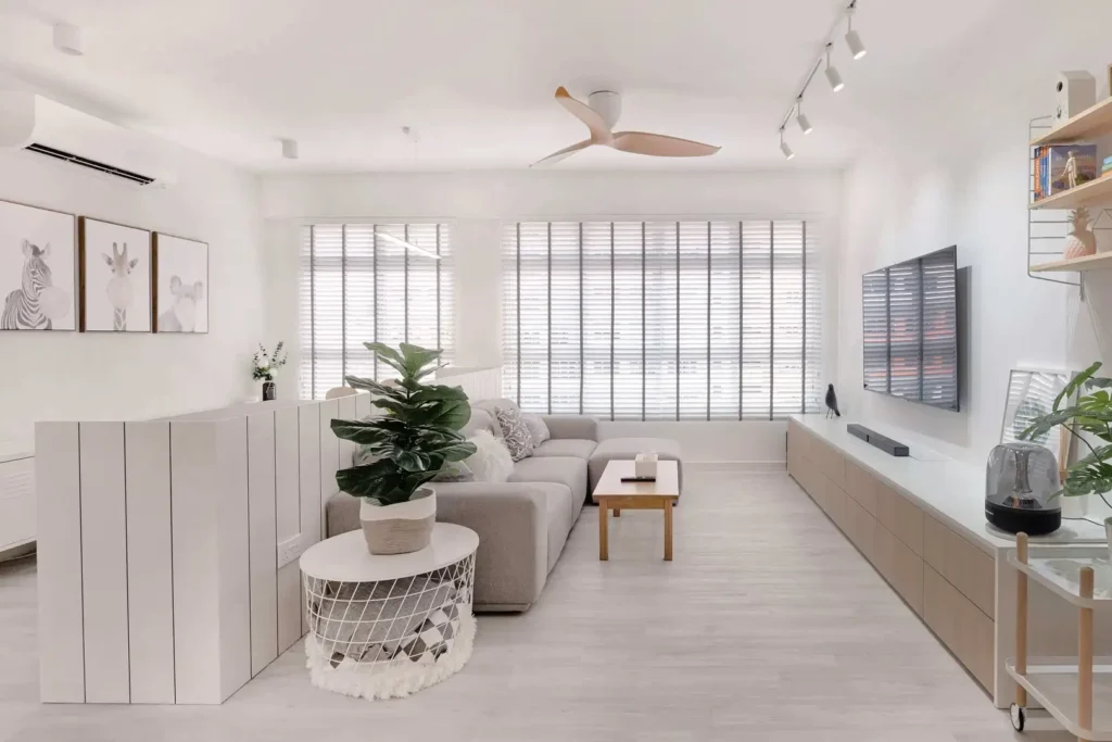 Small Scandinavian living room in KL condo with grey sofa, indoor plant and long media cabinet