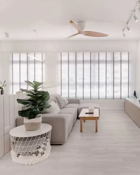 Small Scandinavian living room in KL condo with grey sofa, indoor plant and long media cabinet